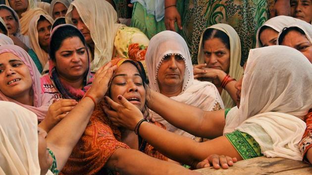 Neha Devi (3L), wife of slain Indian soldier Lance Naik Ranjeet Singh, is consoled by relatives at his home in Burn village, about 28km from Jammu. Two Indian soldiers were killed on July 12 by firing from across the line of control between India and Pakistan in Keran sector of Kupwara district in Kashmir. (AFP) Neha Devi (3L), wife of slain Indian soldier Lance Naik Ranjeet Singh, is consoled by relatives at his home in Burn village, about 28km from Jammu. Two Indian soldiers were killed on July 12 by firing from across the line of control between India and Pakistan in Keran sector of Kupwara district in Kashmir. (AFP)