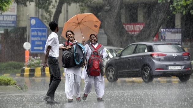 Children enjoy light monsoon showers in New Delhi, India. (Ravi Choudhary/HT PHOTO) Children enjoy light monsoon showers in New Delhi, India. (Ravi Choudhary/HT PHOTO)