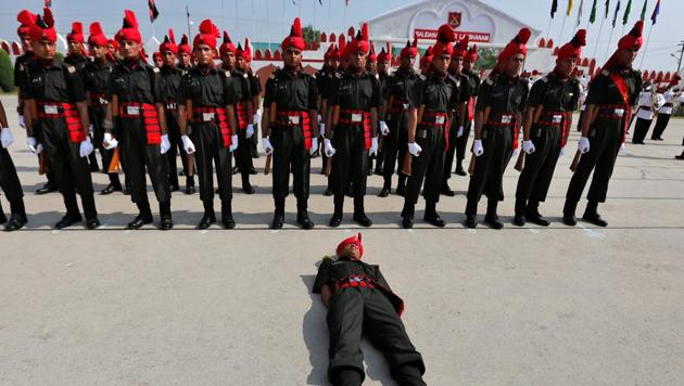 An Indian army recruit faints during a passing out parade at a garrison in Rangreth on the outskirts of Srinagar. (Danish Ismail / REUTERS) An Indian army recruit faints during a passing out parade at a garrison in Rangreth on the outskirts of Srinagar. (Danish Ismail / REUTERS)