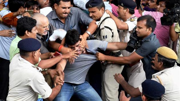 Bihar Deputy Chief Minister Tejashwi Yadav's security personnel clash with a media persons in Patna. (PTI) Bihar Deputy Chief Minister Tejashwi Yadav's security personnel clash with a media persons in Patna. (PTI)