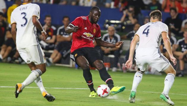 Manchester United’s Romelu Lukaku (C) in action against Los Angeles Galaxy during a friendly match.(AFP)