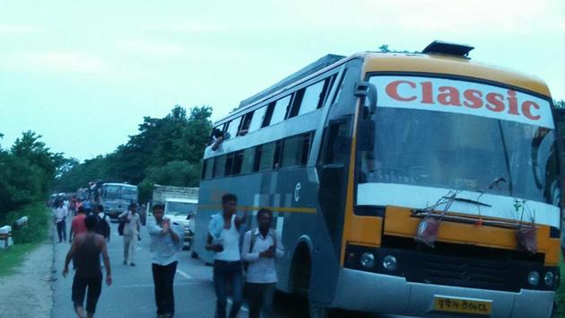 Kanwariyas blocked the Haridwar-Bijnor highway after a bus ran over a woman pilgrim in Haridwar on Sunday. (HT Photo) Kanwariyas blocked the Haridwar-Bijnor highway after a bus ran over a woman pilgrim in Haridwar on Sunday. (HT Photo)
