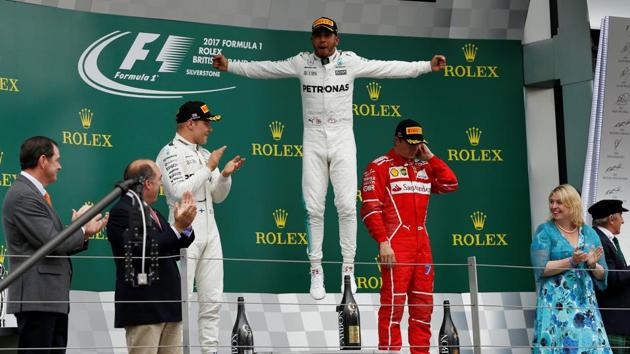 Mercedes' Lewis Hamilton celebrates his win in the Formula One British Grand Prix with teammate Valtteri Bottas and Ferrari's Kimi Raikkonen. (Reuters) Mercedes' Lewis Hamilton celebrates his win in the Formula One British Grand Prix with teammate Valtteri Bottas and Ferrari's Kimi Raikkonen. (Reuters)