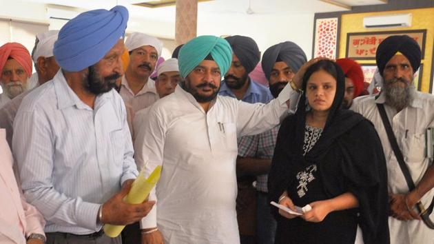 Cabinet Minister Sadhu Singh Dharamsot attending the bhog ceremony of the Wing Commander Mandeep Singh Dhillon in Patiala on Sunday.(HT Photo)