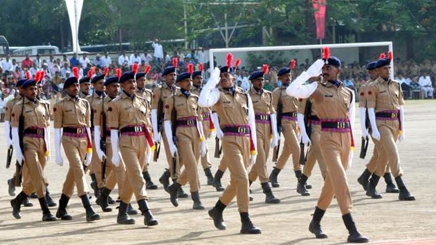 SRPF cadets salute the guests on the podium during passing out parade in Pune. (HT PHOTO)