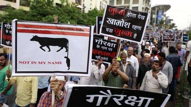 People participate in the silent protest #NotInMyName, organised against the increasing number of lynching incidents in the country at Kondwa on Saturday.(HT PHOTO)