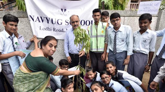 NDMC Chairperson Naresh Kumar during a plantation drive at Navyug School, Lodhi Colony in New Delhi, India, on Saturday. (Ravi Choudhary/HT PHOTO) NDMC Chairperson Naresh Kumar during a plantation drive at Navyug School, Lodhi Colony in New Delhi, India, on Saturday. (Ravi Choudhary/HT PHOTO)