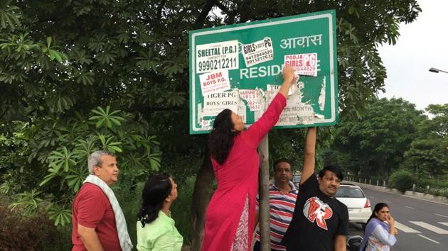 Many signboards and direction boards in the city are covered with posters and banners. Many signboards and direction boards in the city are covered with posters and banners.