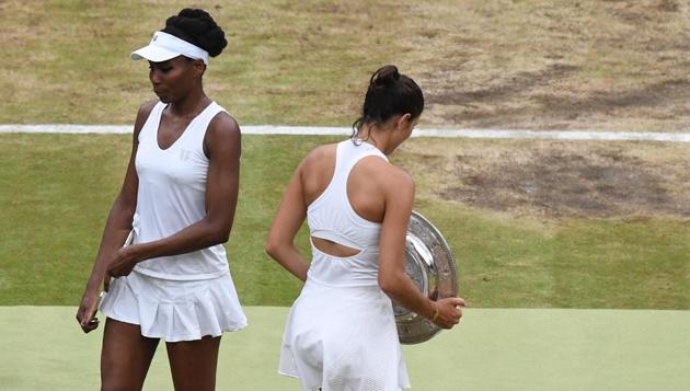 Garbine Muguruza (R) passes Venus Williams after winning the women's singles Wimbledon final. (AFP) Garbine Muguruza (R) passes Venus Williams after winning the women's singles Wimbledon final. (AFP)