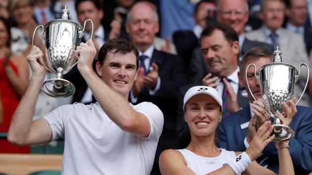 Jamie Murray and Martina Hingis pose as they celebrate with their trophies after winning the Wimbledon mixed doubles final. (REUTERS) Jamie Murray and Martina Hingis pose as they celebrate with their trophies after winning the Wimbledon mixed doubles final. (REUTERS)