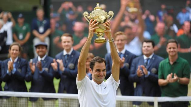 Switzerland’s Roger Federer celebrates with the Wimbledon trophy after winning the men’s singles final against Croatia’s Marin Cilic on Sunday. (Reuters) Switzerland’s Roger Federer celebrates with the Wimbledon trophy after winning the men’s singles final against Croatia’s Marin Cilic on Sunday. (Reuters)