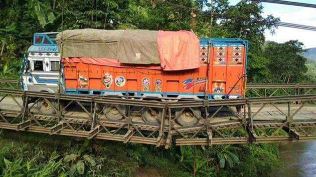 British era steel bridge across river Barak on a national highway collapsed partially in Manipur. (HT Photo) British era steel bridge across river Barak on a national highway collapsed partially in Manipur. (HT Photo)