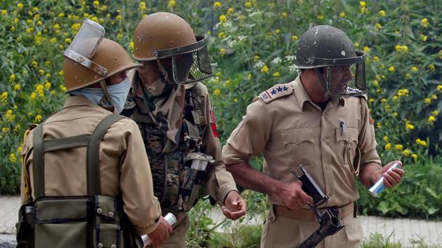 Representative Image | Police officers prepare to fire tear gas during disturbances in Srinagar, Kashmir. (REUTERS) Representative Image | Police officers prepare to fire tear gas during disturbances in Srinagar, Kashmir. (REUTERS)
