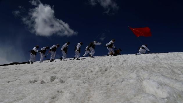New recruits of the Chinese People's Liberation Army (PLA) patrol the border area at Ngari, Tibet Autonomous Region, China, in this file photo from April 2017. (REUTERS)