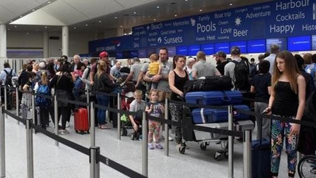 People queue with their luggage for the British Airways check-in desk at Gatwick Airport in southern England, Britain, May 28, 2017.(Reuters File Photo)