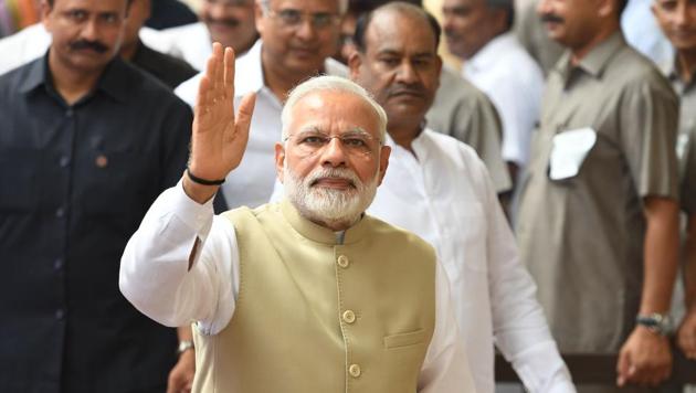 PM Modi walks to Opposition benches in Parliament, greets Sonia with ...