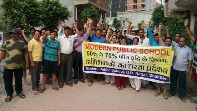 Parents held a protest rally against Modern Public School, Shahberi on Sunday. Parents held a protest rally against Modern Public School, Shahberi on Sunday.