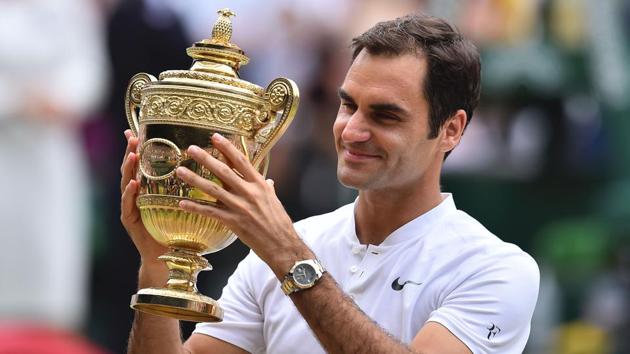 Roger Federer created history as he won the Wimbledon title for a record eighth time, beating the previous record held by Pete Sampras.(AFP)