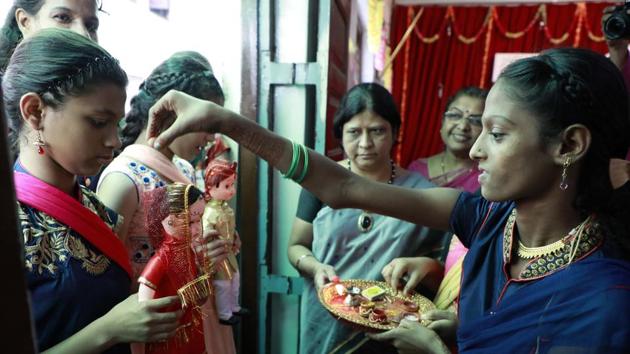 The dolls are ready to tie the knot and the children grace them with their blessings. (Rahul Raut/HT PHOTO) 