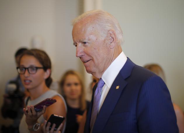 Former US vice president Joe Biden walks past members of the media as he heads to a meeting with a group of Congressional Pages on Capitol Hill in Washington on July 11, 2017. (AP) Former US vice president Joe Biden walks past members of the media as he heads to a meeting with a group of Congressional Pages on Capitol Hill in Washington on July 11, 2017. (AP)