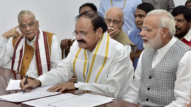 National Democratic Alliance vice-presidential candidate Venkaiah Naidu (C) files his nomination papers in the presence of Prime Minister Narendra Modi (R) at the parliament in New Delhi on Tuesday. (PTI Photo) National Democratic Alliance vice-presidential candidate Venkaiah Naidu (C) files his nomination papers in the presence of Prime Minister Narendra Modi (R) at the parliament in New Delhi on Tuesday. (PTI Photo)