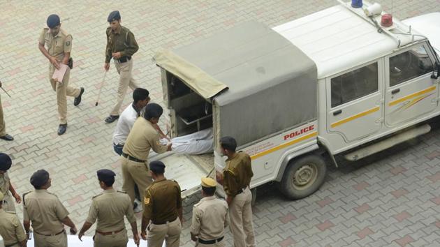 Police taking the body of the accused, Suraj Singh, for post-mortem at IGMC hospital on Wednesday. (Deepak Sansta/HT Photo) 