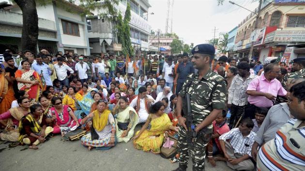 BJP supporters along with Indigenous People Front of Tripura block a road during a protest to demand for a separate state of 'ipraland, in Agartala on Tuesday. (PTI Photo) BJP supporters along with Indigenous People Front of Tripura block a road during a protest to demand for a separate state of 'ipraland, in Agartala on Tuesday. (PTI Photo)
