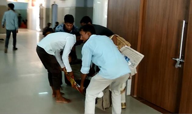 Relatives of a patient lug him on a bedsheet for OPD consultation in absence of trolley at the IGIMS, in Patna on Wednesday. (Ruchir Kumar/HT Photo) Relatives of a patient lug him on a bedsheet for OPD consultation in absence of trolley at the IGIMS, in Patna on Wednesday. (Ruchir Kumar/HT Photo)