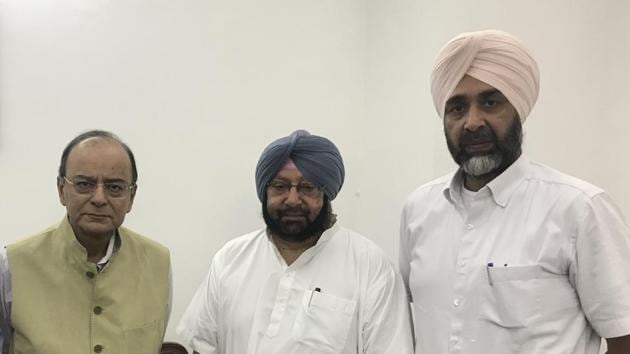 Union finance minister Arun Jaitley, Punjab CM Capt Amarinder Singh and Punjab finance minister Manpreet Badal in New Delhi on Thursday.(HT Photo)