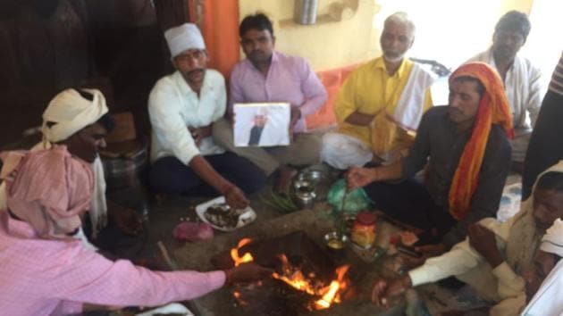 Villagers perform a yagna at Ram Nath Kovind’s village in Paraunkh Kanpur Dehat district on Thursday. (Haider A Naqvi/HT Photo) Villagers perform a yagna at Ram Nath Kovind’s village in Paraunkh Kanpur Dehat district on Thursday. (Haider A Naqvi/HT Photo)