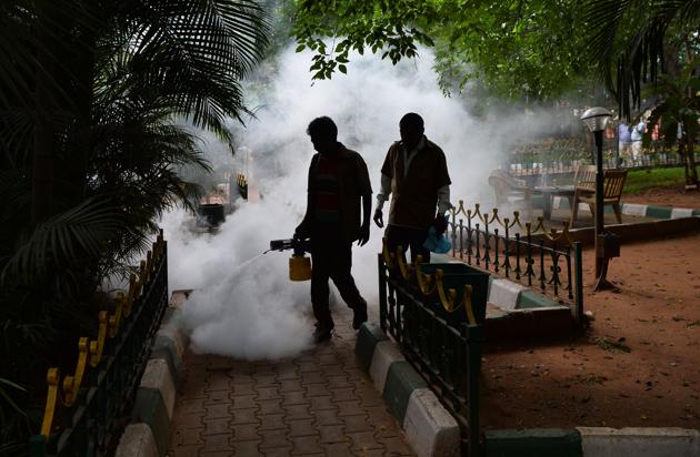 Municipal workers fumigate a park in a bid to kill off mosquitoes in Bengaluru. Over 18,700 cases of dengue have been reported in India this year.(AFP)