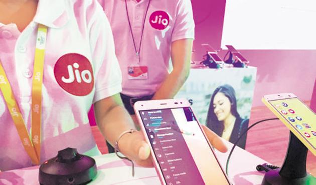 A Reliance employee demonstrates Jio LYF smartphone at their headquarters on the outskirts of Mumbai. The company is planning to launch 4G feature phones in the second half of August. (REUTERS) A Reliance employee demonstrates Jio LYF smartphone at their headquarters on the outskirts of Mumbai. The company is planning to launch 4G feature phones in the second half of August. (REUTERS)