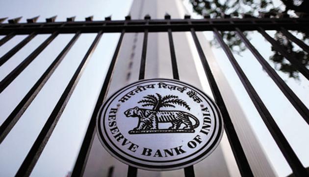 The Reserve Bank of India (RBI) seal is pictured on a gate outside the RBI headquarters in Mumbai.(REUTERS)