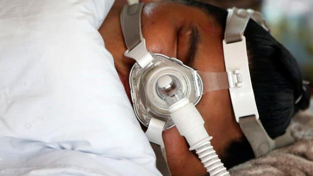 Sumo wrestler Kaiho takes a post meal nap using respirators to aid breathing. The ‘rikishis’ or wrestlers take to naps lasting several hours immediately after eating to maintain the signature heft associated with sumo wrestlers. (Issei Kato / REUTERS) Sumo wrestler Kaiho takes a post meal nap using respirators to aid breathing. The ‘rikishis’ or wrestlers take to naps lasting several hours immediately after eating to maintain the signature heft associated with sumo wrestlers. (Issei Kato / REUTERS)