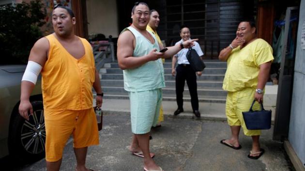 Sumo wrestlers Kyokutaisei, Mongolian-born Kyokushuho, Brazilian-born Kaisei and Asahisho, prepare to leave the Ganjoji Yakushido temple for a dinner being hosted for them, in Nagoya, Japan. (Issei Kato / REUTERS) Sumo wrestlers Kyokutaisei, Mongolian-born Kyokushuho, Brazilian-born Kaisei and Asahisho, prepare to leave the Ganjoji Yakushido temple for a dinner being hosted for them, in Nagoya, Japan. (Issei Kato / REUTERS)