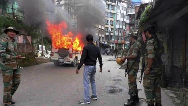 A vehicle in flames after it was set on fire by the protesters in Darjeeling on Wednesday. (PTI Photo) A vehicle in flames after it was set on fire by the protesters in Darjeeling on Wednesday. (PTI Photo)