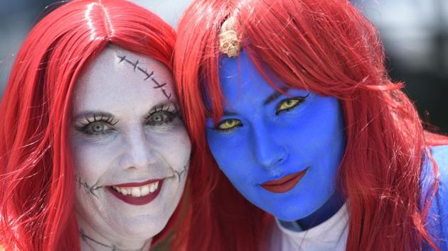 Cherish Johnson, left, dressed as Sally from ‘The Nightmare Before Christmas,’ and Megan Severns, dressed as Mystique from the ‘X-Men’ franchise, pose together on day one of Comic-Con International. (Chris Pizzello/Invision/AP)