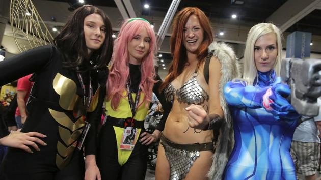 From left, women play the parts of Wasp from Marvel Comics, Pixie from X-Men, Red Sonja from Marvel Comics and Samus from Nintendo during Comic-Con 2017. (Bill Wechter / AFP)