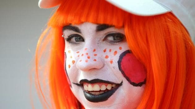 Attendee Emily Brewer of Carlsbad arrives for the opening day of Comic Con International. (Mike Blake / REUTERS)