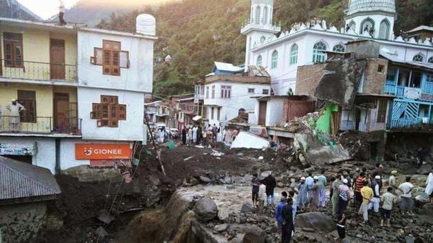 Indian rescue workers and policemen look for survivors in the rubble of a collapsed house after flash floods in Thatri village of Doda district in the northern state of Jammu and Kashmir. (AFP) Indian rescue workers and policemen look for survivors in the rubble of a collapsed house after flash floods in Thatri village of Doda district in the northern state of Jammu and Kashmir. (AFP)