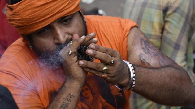 The annual Kanwar Yatra spells a disruption in normal life for North India with the kanwars taking over public life, occupying roads and public spaces, causing traffic congestions and altercations that often make headlines. This season alone, kanwariyas have been in news for falling off trains, being electrocuted on a street, being hit by a bus, vandalizing buses, blocking highways, blowing up a police vehicle and later a police station. (Vipin Kumar / HT Photo) 