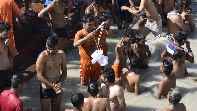 The arrival of the kanwars in Haridwar spells the deployment of special police battalions, while in Delhi is means a shutdown of schools. Along the highway from Delhi to Haridwar, unofficial bans on the sale of meat and poultry and the lockdown or concealment of eateries that serve non-vegetarian food to prevent altercations based on religious sentiments can be observed.  (Vipin Kumar / HT Photo) 