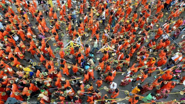 Karwariyas make their pilgrimage carrying the kawar (containers of holy water balanced on the sides of a pole) on their shoulders during the month of Sawan in Jabalpur. (PTI) Karwariyas make their pilgrimage carrying the kawar (containers of holy water balanced on the sides of a pole) on their shoulders during the month of Sawan in Jabalpur. (PTI)