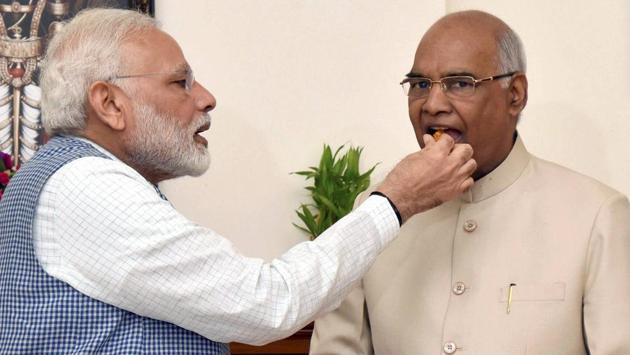 Prime Minister Narendra Modi offers sweets to Ram Nath Kovind, congratulating him on winning the election to the post of the 14th President of India. (PTI) Prime Minister Narendra Modi offers sweets to Ram Nath Kovind, congratulating him on winning the election to the post of the 14th President of India. (PTI)