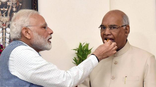 Prime Minister Narendra Modi offers sweets to Ram Nath Kovind as he congratulates him on being elected as the 14th President of India, in New Delhi. (PTI Photo) Prime Minister Narendra Modi offers sweets to Ram Nath Kovind as he congratulates him on being elected as the 14th President of India, in New Delhi. (PTI Photo)