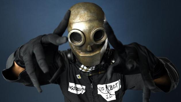 Lawrence Hollie, of Burbank Calif, dressed as Goth Robot 2.0 poses for a portrait on day one. (Chris Pizzello/Invision/AP)