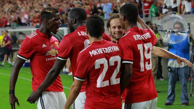 Manchester United players celebrate after defeating Manchester City 2-0 in the International Champions Cup.(Reuters)