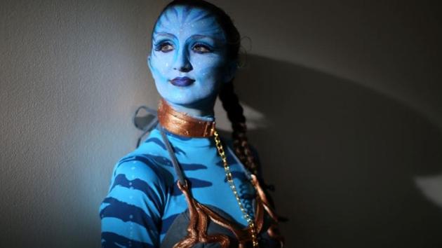 Emjaye Adamson of San Diego poses for a picture during opening day of Comic Con International in San Diego, California. (Mike Blake / Reuters)