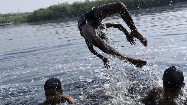 A rise in water levels due to the monsoon and the letting of waters from further upstream makes it the best period during the year for swimmers just taking to water or the more experienced among them.  (Saumya Khandelwal / HT Photo) 