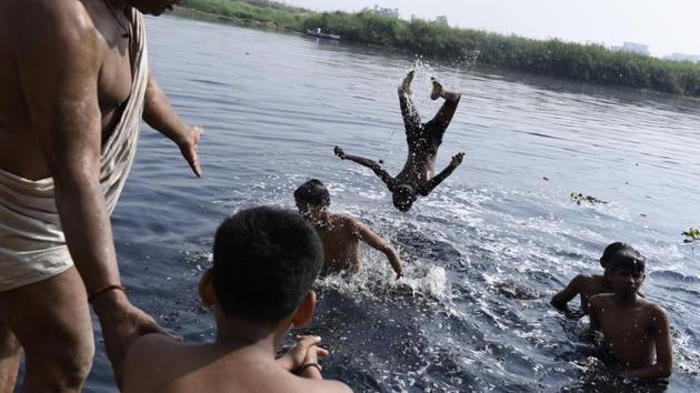 Bathing, using its water, and swimming in the Yamuna is akin to a fact of life for those who live around it. Many consider it a ‘mother’ like figure with thoughts of hazards around it hard to entertain. (Saumya Khandelwal / HT Photo) 